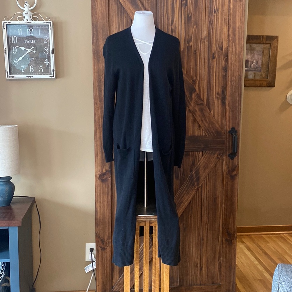 Full length black cardigan. Very basic. Medium weight.